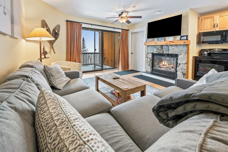 Living area with cozy stone fireplace