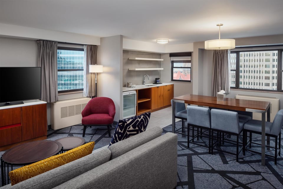 Suite, 1 King Bed, Non Smoking | Living area | 37-inch TV with premium channels, DVD player, iPod dock