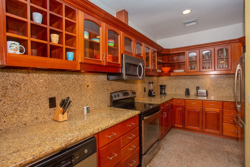 The kitchen is open and filled with modern appliances