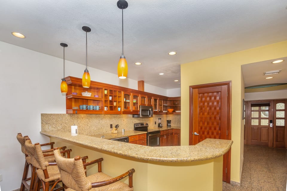 The kitchen has a breakfast bar for additional seating