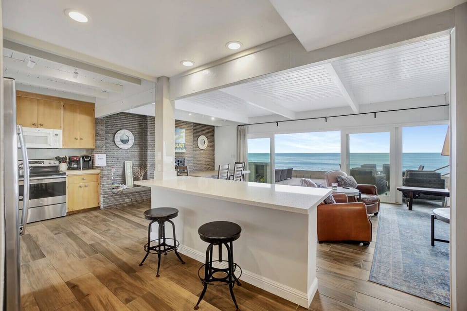 Kitchen with breakfast bar and ocean view.