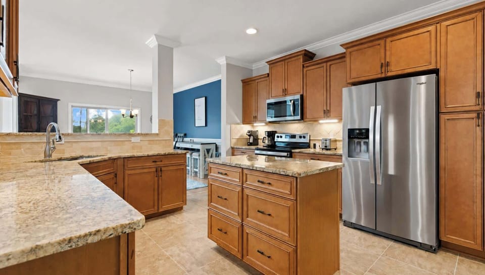 Fully stocked kitchen with granite countertops. 