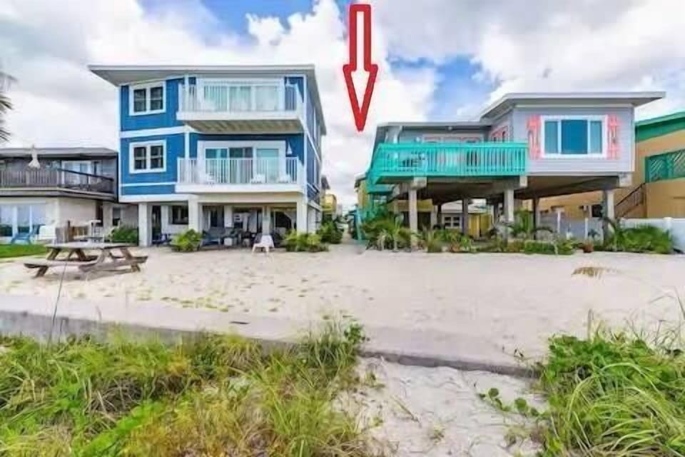 Bungalow is located behind the blue house with direct access to the walkway to the beach