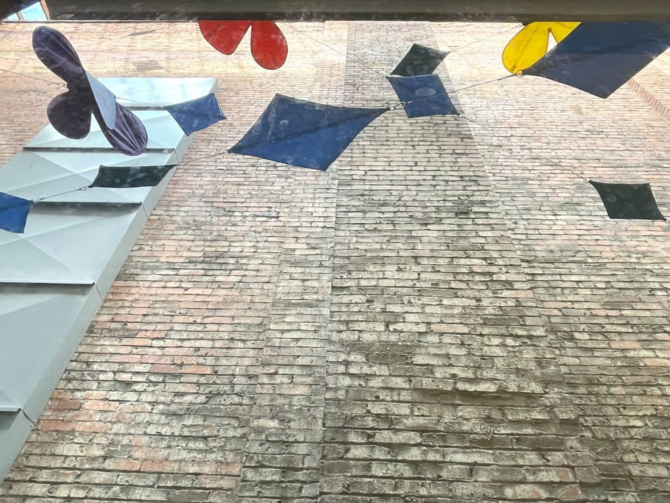View from windows in Apartment 208 showing lightwell and playful kites