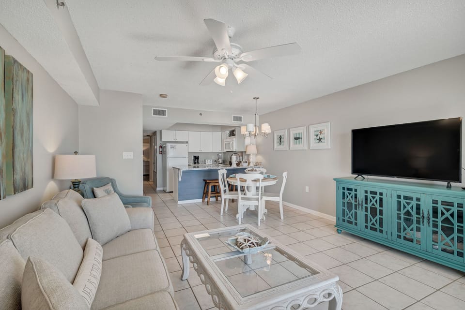 Open-concept living designed for the beach. Enjoy the seamless flow from the dining area through to the living space, where the spectacular ocean views take center stage.