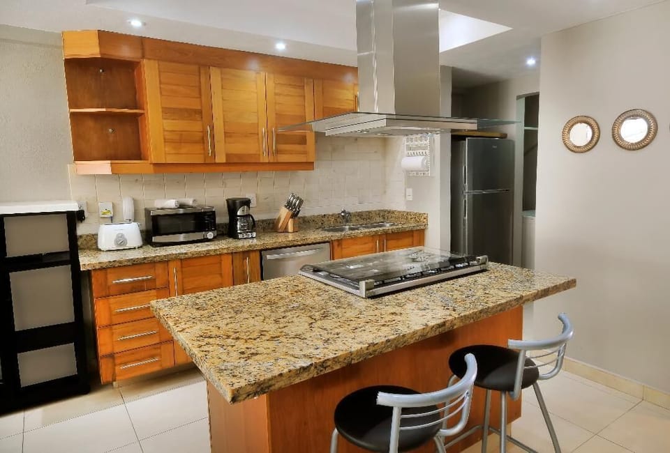 Kitchen: stovetop & hood/dishwasher/refrigerator/utensils/dishes/pots/pans
