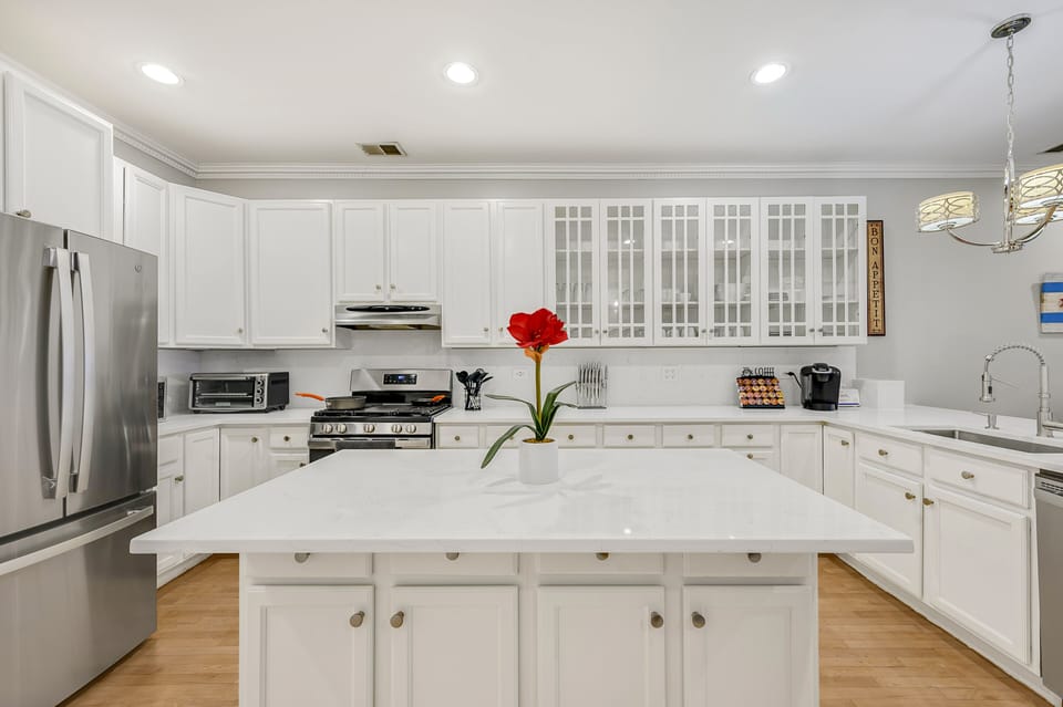Check out the large kitchen! Stocked with utensils, dishware, and a KCup machine