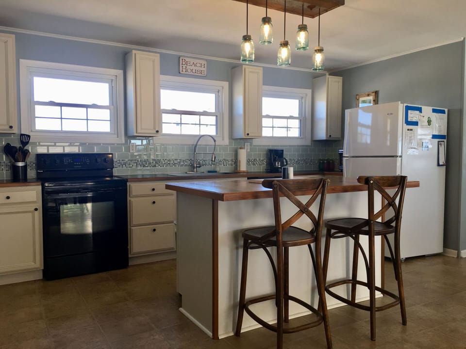 Spacious kitchen with bar seating.