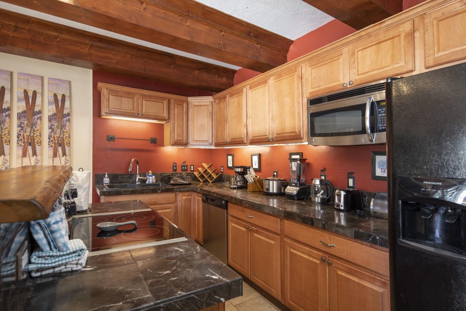 Full kitchen off of the living room.