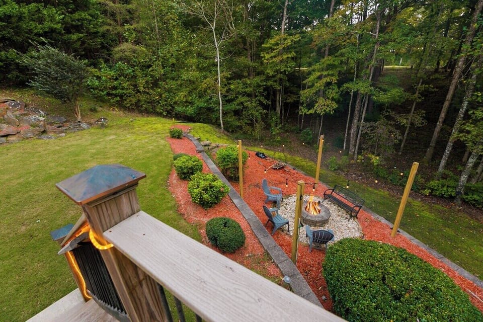 Deck overlooking beautiful back yard fire pit