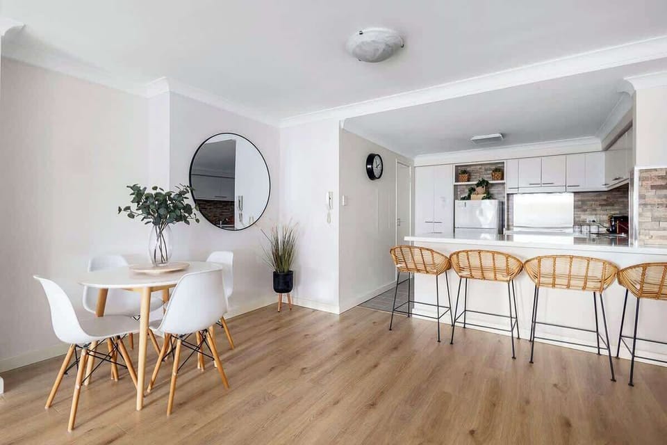 Gather in this bright, open space—perfect for everything from casual breakfasts at the kitchen island to dinners at the dining table, with plenty of room for conversation.