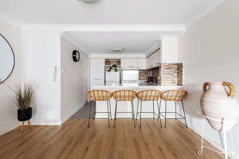 Gather and connect in this stylish kitchen, perfect for quick bites or lively conversations.