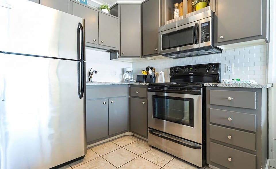 Cook away on these upgraded new stainless steel appliances and remodeled kitchen cabinets.
