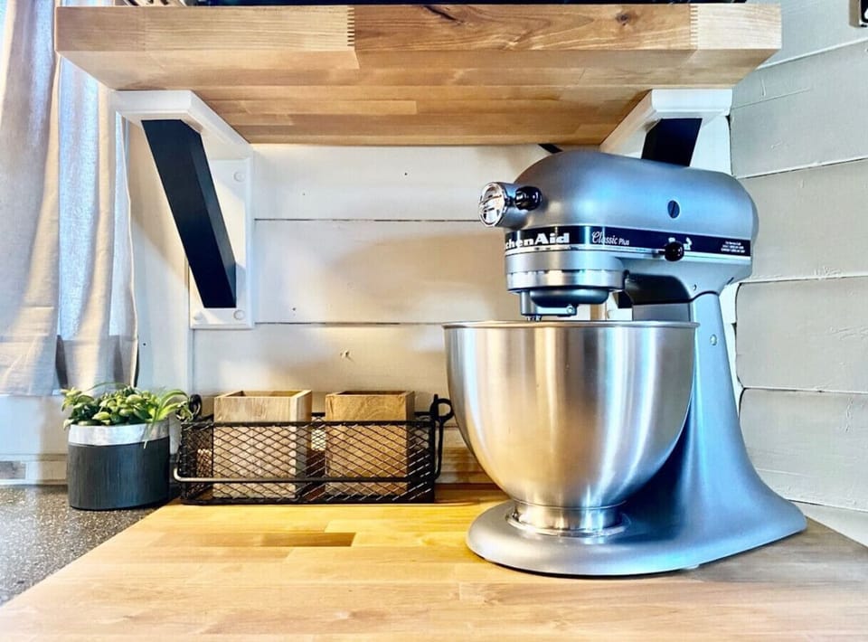 Whip up homemade treats with the KitchenAid mixer—bake, blend, and create in your cozy cabin kitchen.