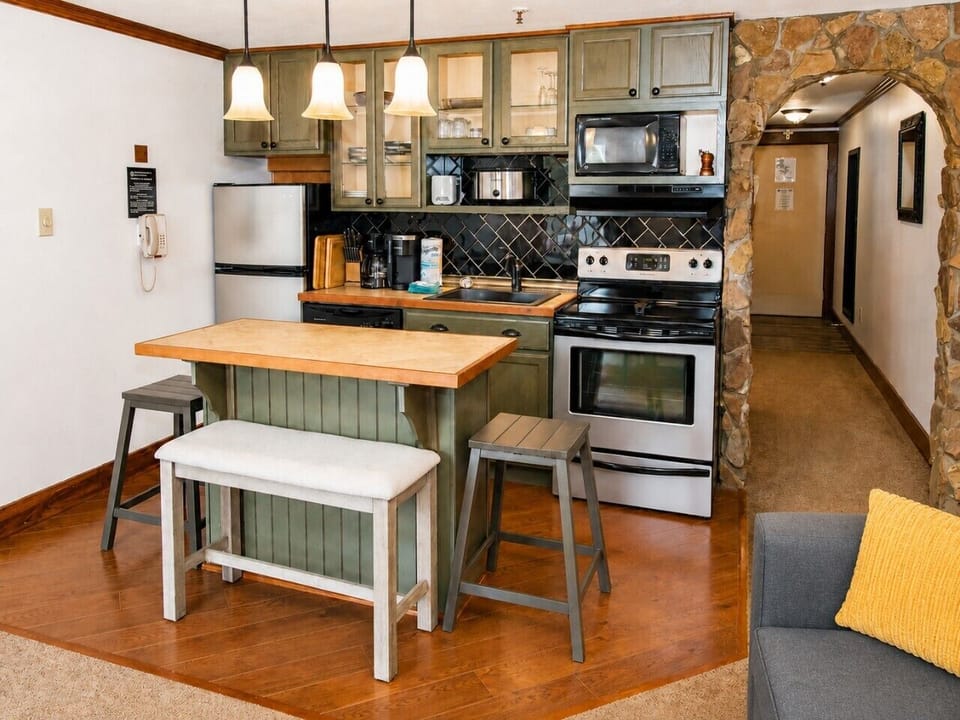 There is a fully-equipped kitchen and counter seating for four