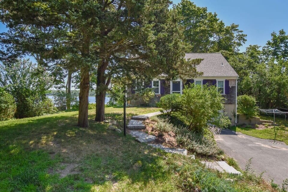 Side view of the home with steps leading to front door