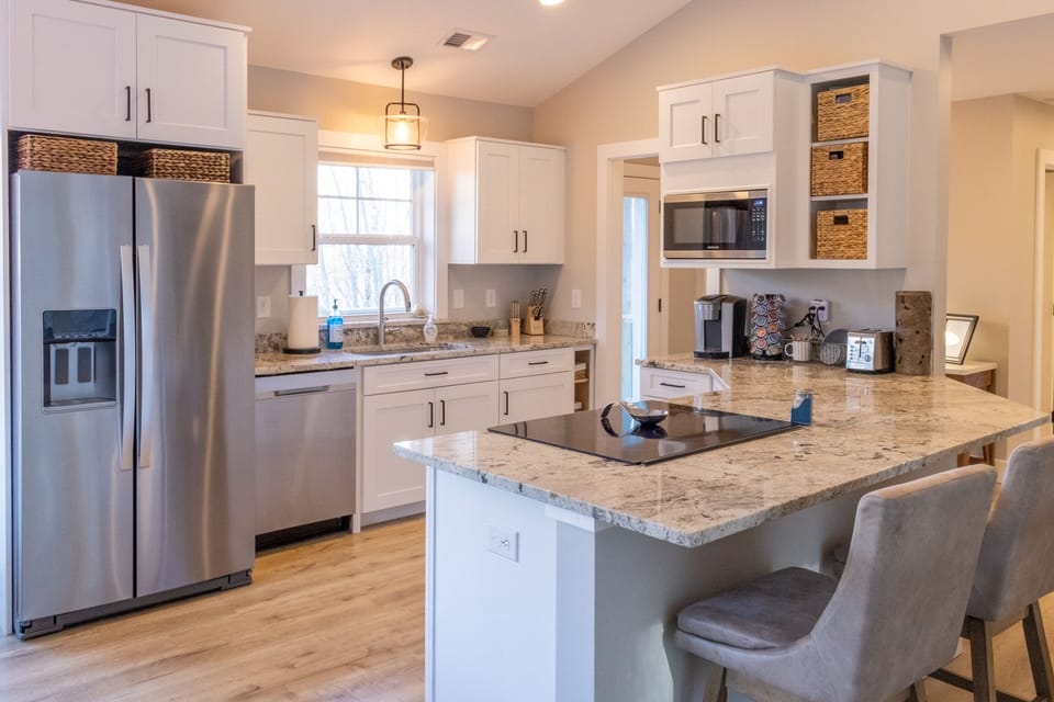 Open concept kitchen with bar seating 