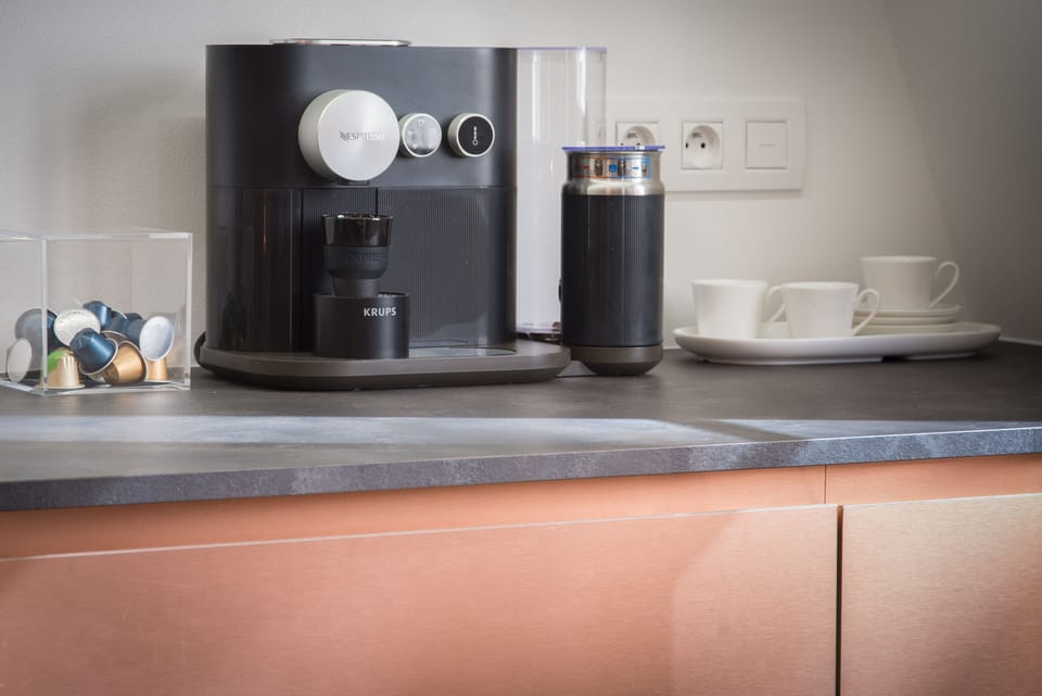 Enjoy fresh coffee in the morning from a Nespresso machine. 