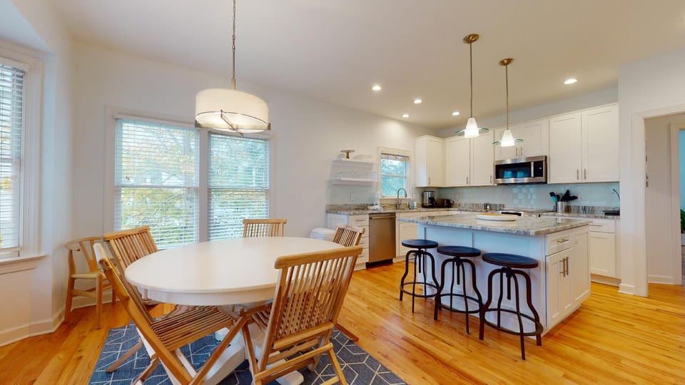 Open combination kitchen and dining room with plenty of seating
