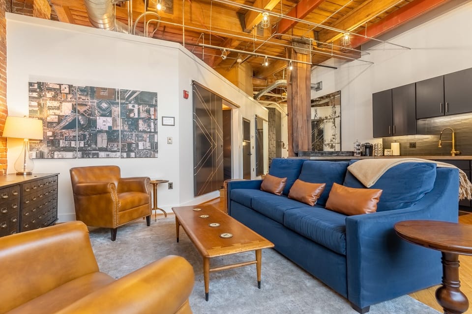 American Leather brand blue velvet couch brings comfort and a pop of color to the loft