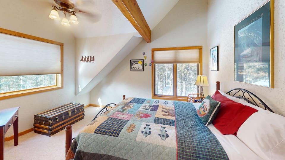 Upstairs, the second bedroom has a queen-sized bed