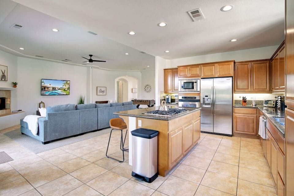 Chef`s Kitchen view overlooking living area. Fully stocked with plates, glasses, silverware, pots/pans, appliances, spices and oils.