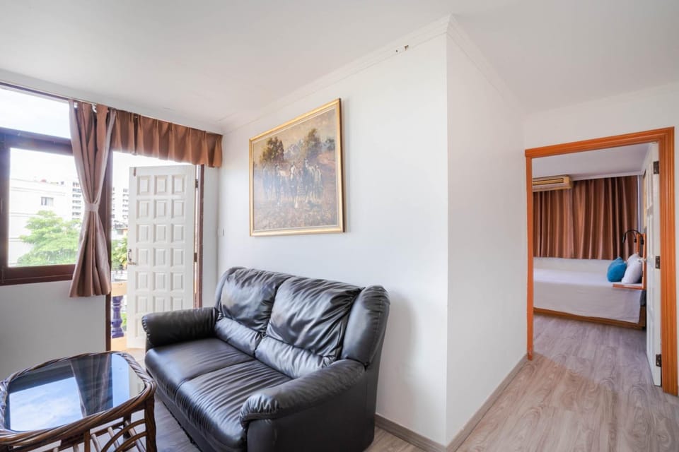 Deluxe Double Room | Living room | 43-inch LED TV with cable channels, TV