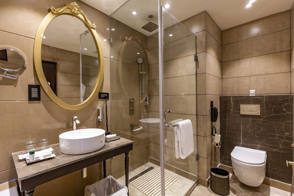 Shower, rainfall showerhead, designer toiletries, hair dryer