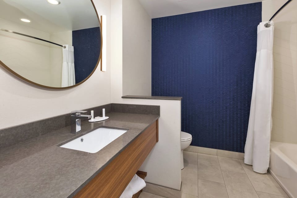 Basic Room, 2 Queen Beds | Bathroom | Hair dryer, towels, soap, shampoo