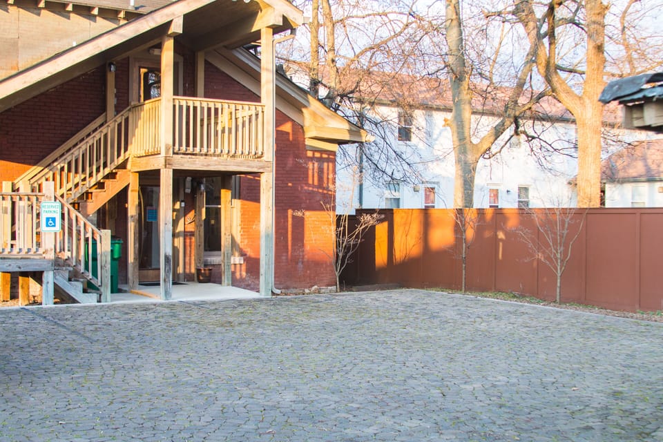 Apt.entrance and parking area accessed from alley behind the house, entrance is upstairs from rear of house, office on main level