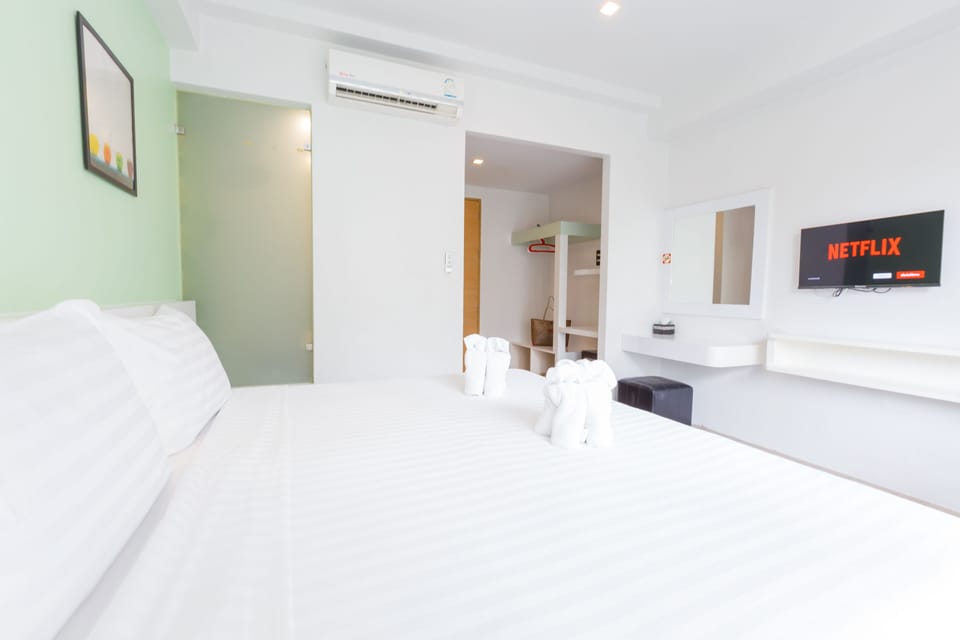Deluxe Room, Pool Access | Minibar, in-room safe, desk, free WiFi
