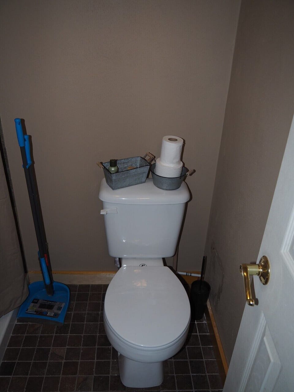 BATHROOM:  Features a shower and toilet.  (Note that there is no vanity, sink, or mirror in the bathroom.)