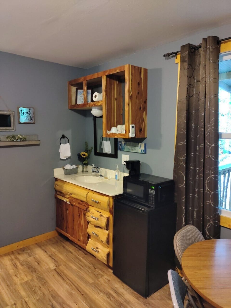 MAIN ROOM:  The main room, which features 6 beds (5 twins and 1 double), a small dining table, and a small sink / kitchenette.