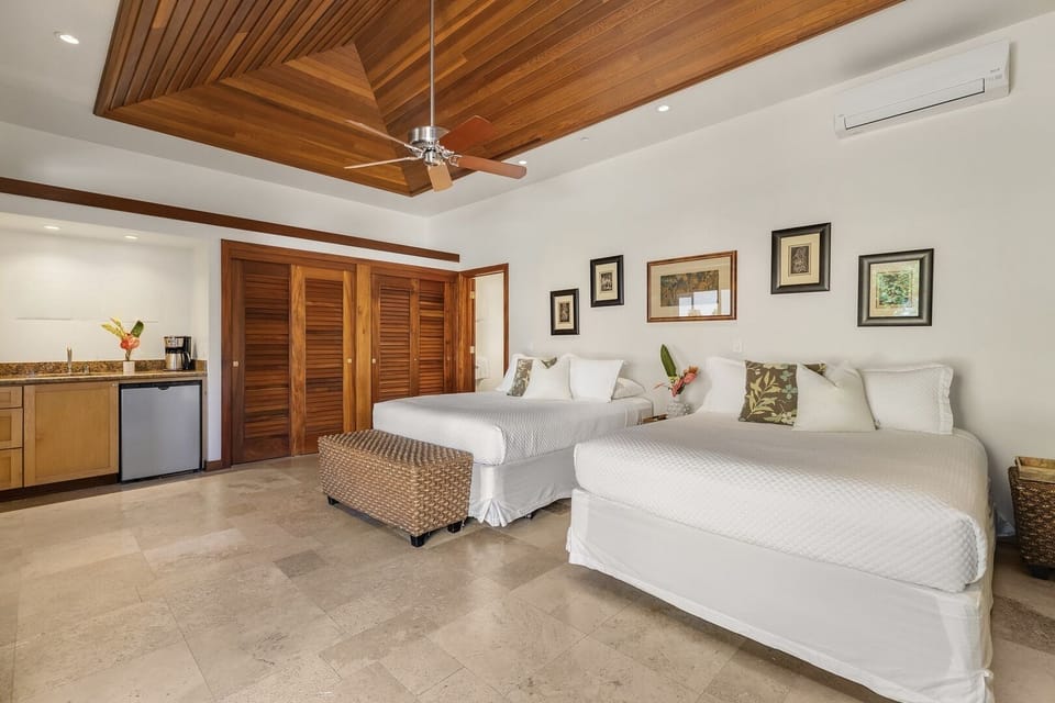 Guest House has separate courtyard entrance and is furnished with 2 Queen Beds, Wet-Bar, Smart TV, and Pool Access