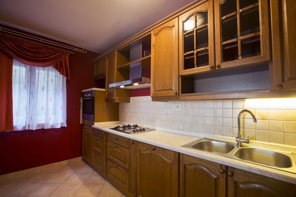 Villa (Four-Bedroom Apartment with Private P) | Private kitchen | Fridge, highchair