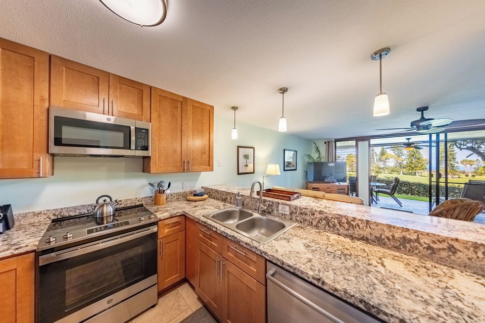 Modern kitchen with stainless steel and granite.
