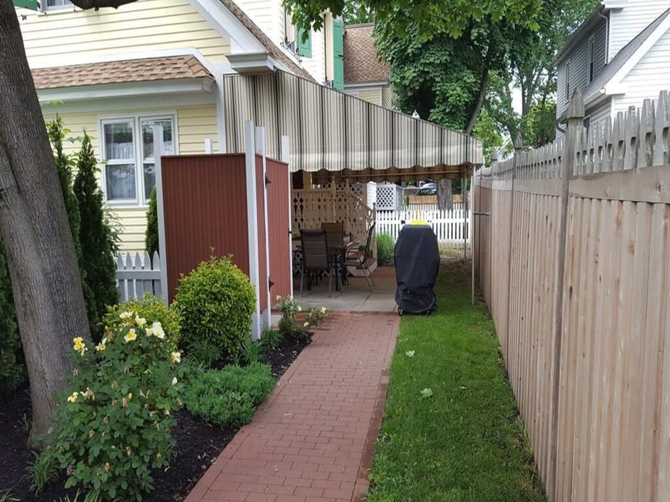 Walkway to Entryway. Covered Patio, outside shower, grill.