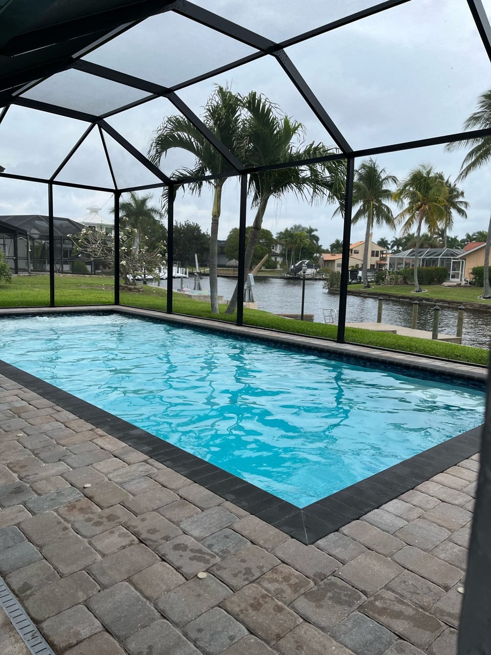Beautiful pool screened in off the water 