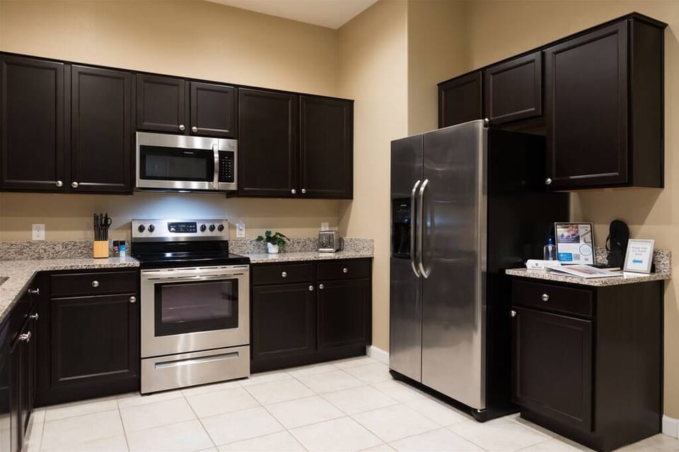 Kitchen w/ granite countertops and stainless steel appliances
