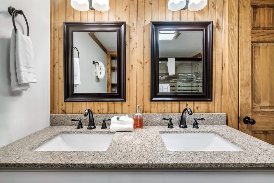 Your bathroom has a double vanity with plenty of space.