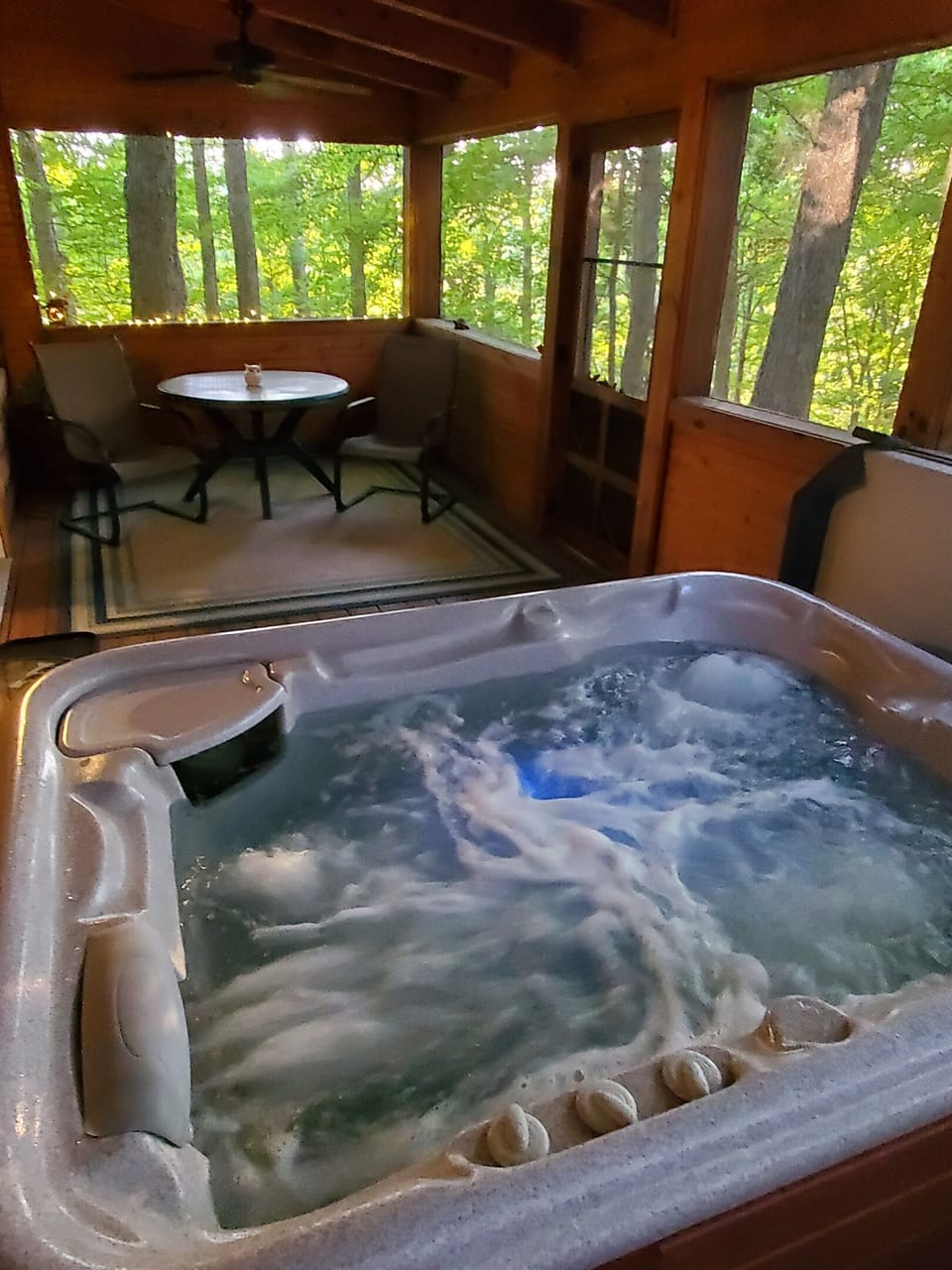 The screened-in porch faces the back so you will have privacy and exclusive use of the hot tub.