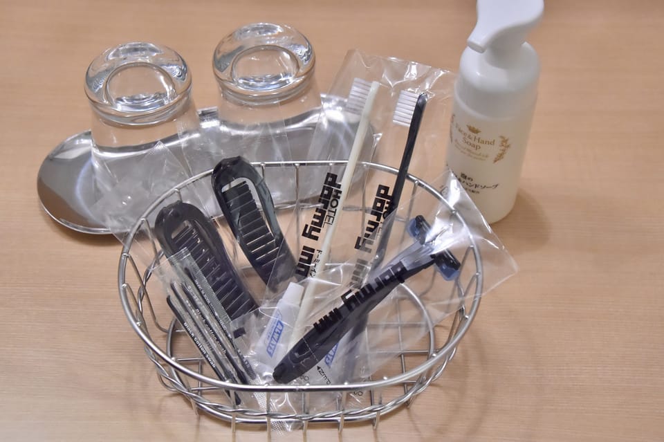 Combined shower/tub, free toiletries, hair dryer, slippers