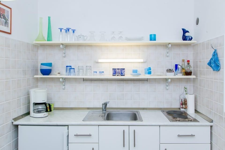 Apartment (One Bedroom Apartment with Two Terrac) | Private kitchen | Fridge, microwave, stovetop, coffee/tea maker