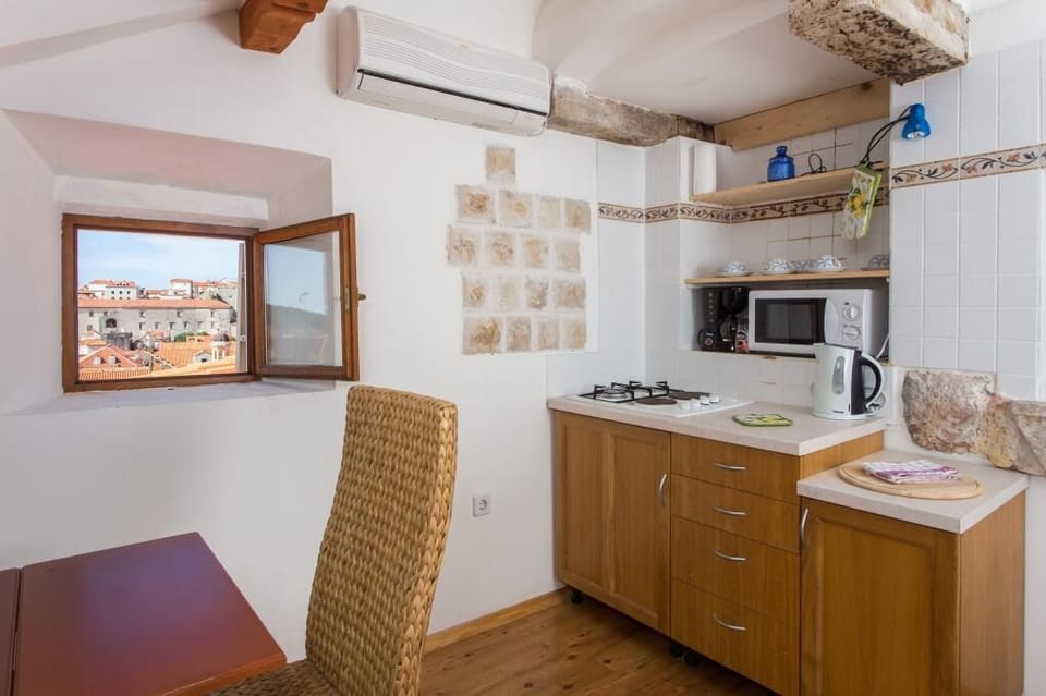 Apartment (Two Bedroom Apartment with Partial Se) | Private kitchenette | Fridge, microwave, stovetop, electric kettle