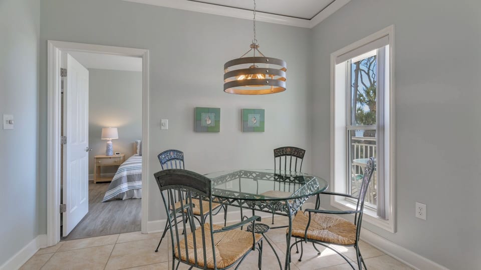 This light-filled dining nook offers a charming spot for casual meals and morning coffee.