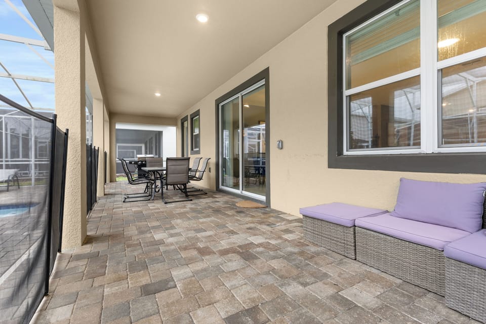 Your private covered lanai offers comfortable seating and dining spaces, perfect for morning coffee or evening relaxation in the Florida sunshine.