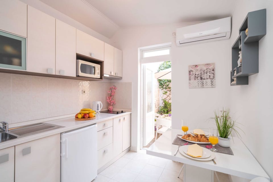Apartment (One Bedroom Apartment) | Private kitchen | Fridge, microwave, dining tables