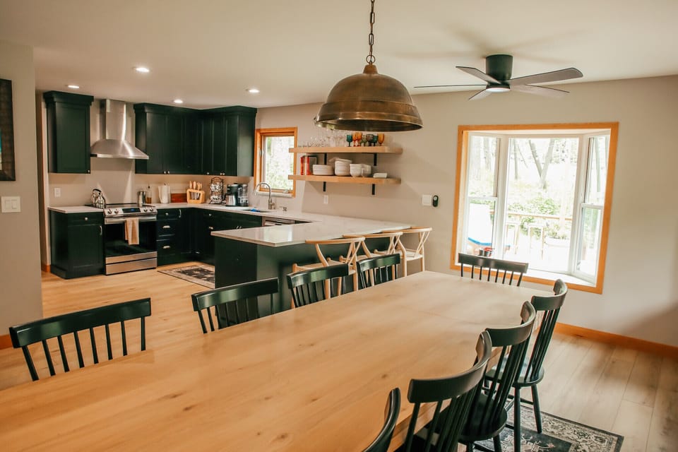Large dining table adjacent to kitchen 