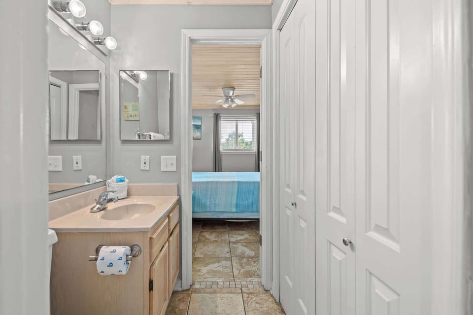 Our one and a half 'Jack & Jill style' bathroom offers a separate toilet & vanity area for both the master bedroom, and the hallway.