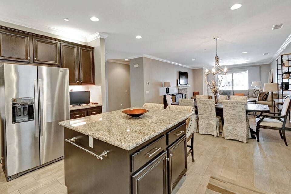 Kitchen & Island, Dining Area and Entrance to Back Patio